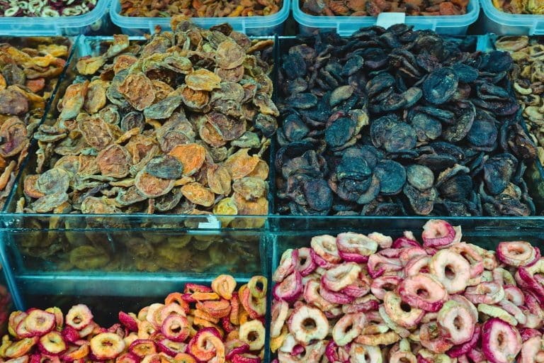 Assortment of dried fruits displayed at a market