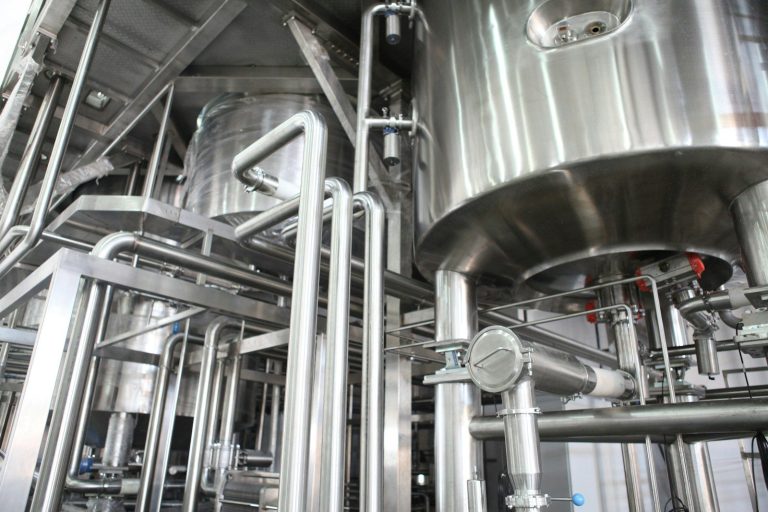Stainless steel processing vessels and pipework used in a food factory.